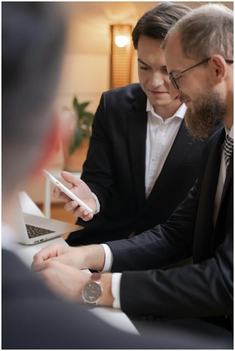 Business professionals interacting with a smartpho