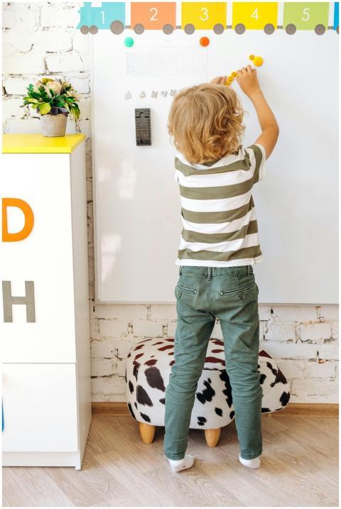 Young child engaging with educational activities o