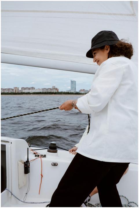 Woman enjoying a sailing adventure on a yacht, pul