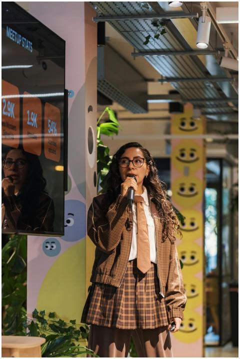 Young woman presenting statistics during a meetup