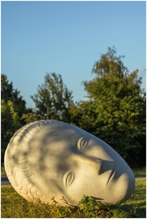 Giant stone head sculpture in a Minsk park during