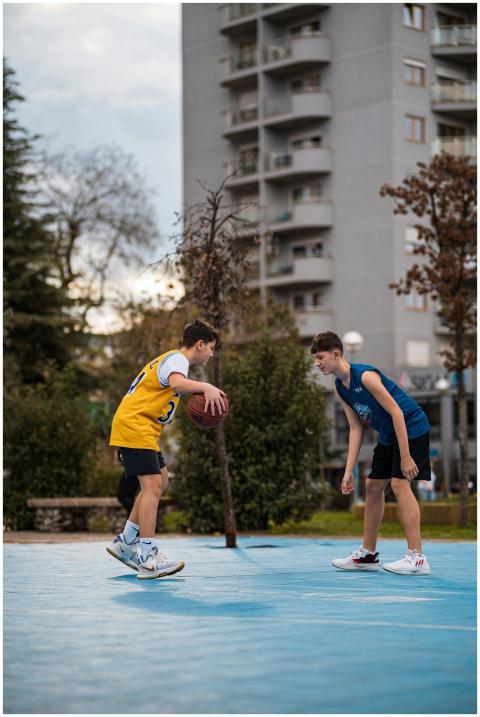 Energetic teenagers enjoying a basketball game in