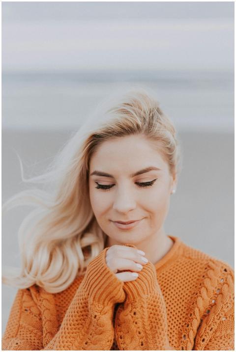 Blonde woman in knitted sweater enjoying a peacefu
