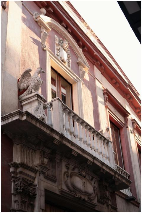 Elegant historic building façade in Seville with c