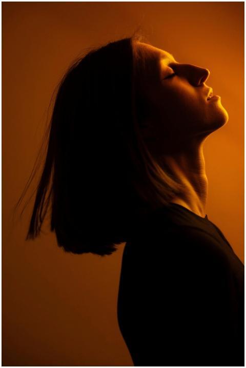 A dramatic side profile portrait of a woman in war