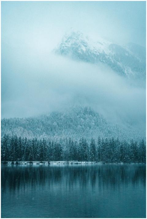 A tranquil winter scene of snow-covered mountains