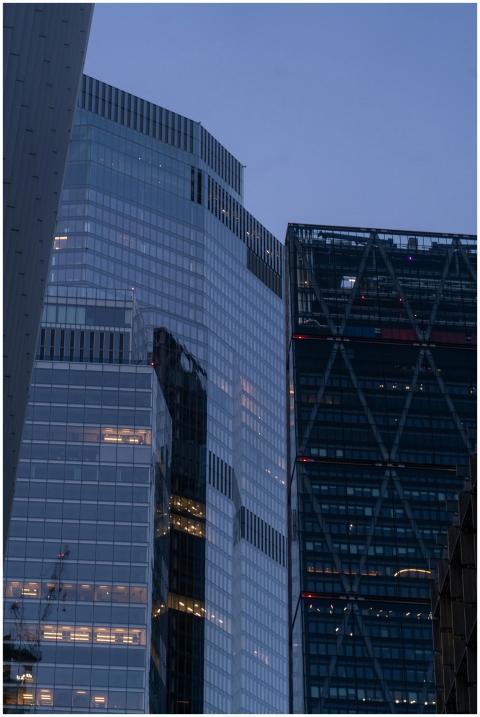 Modern skyscrapers reflecting the city lights in L