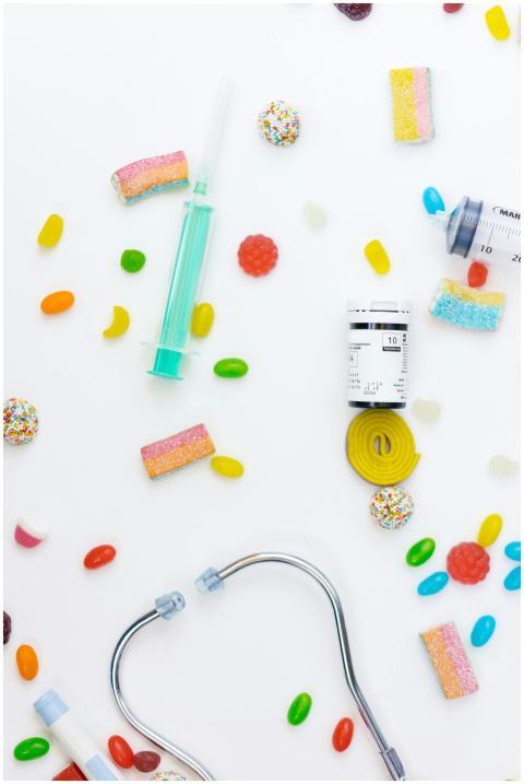 A flat lay of medical items and candies, highlight