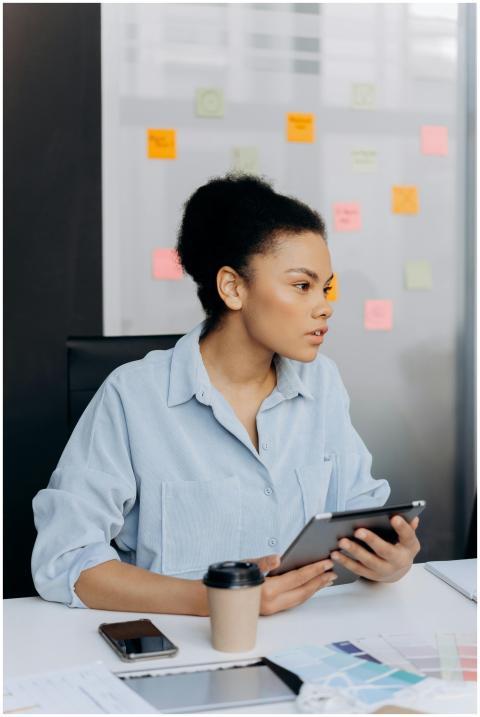 Professional female analyzing work on a tablet in