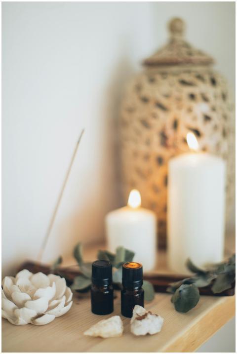 Tranquil scene featuring essential oils, candles,