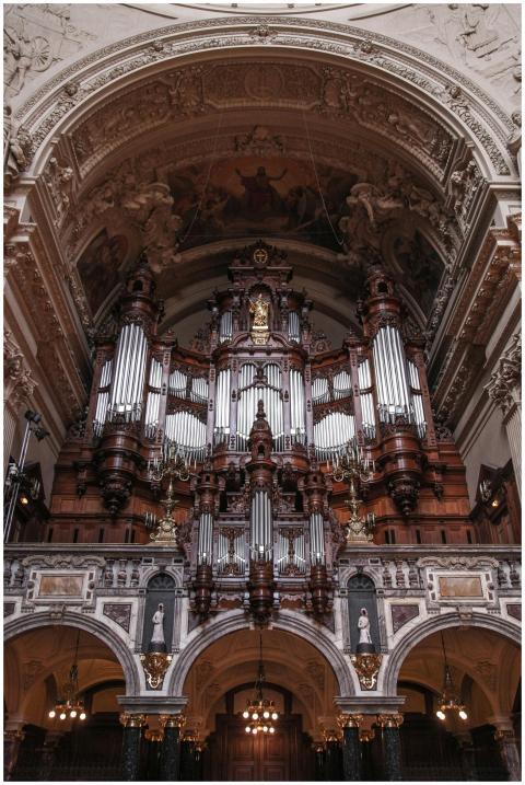 Stunning view of an ornate organ inside a historic