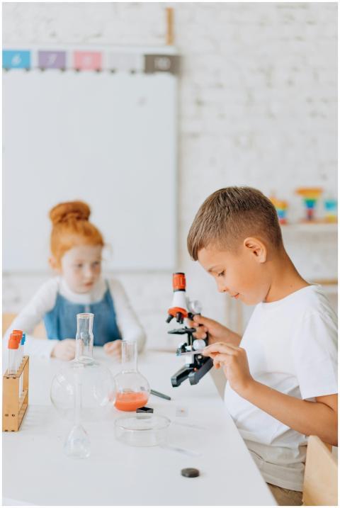Young children engaging in a science experiment wi