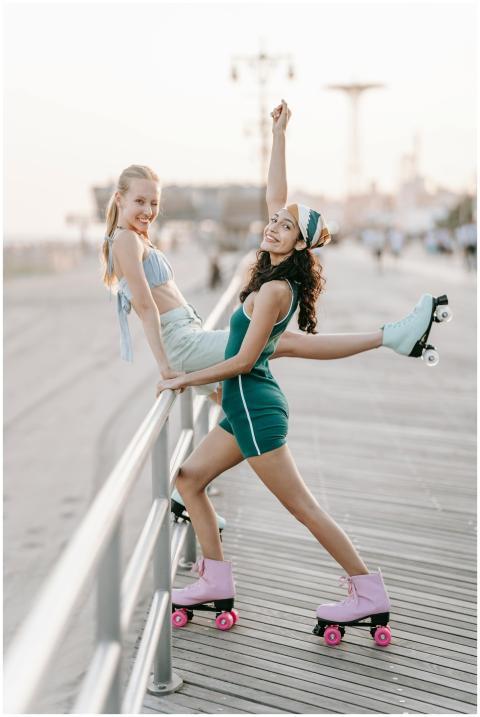Two women enjoying a summer day roller skating on