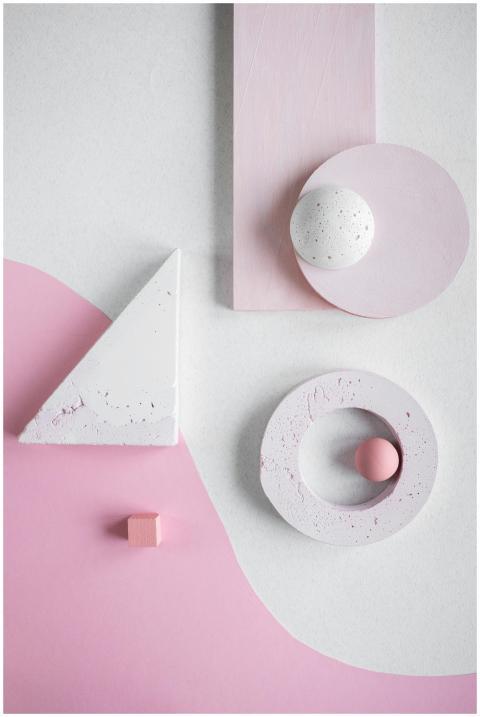 Minimalist pink and white geometric shapes in an a