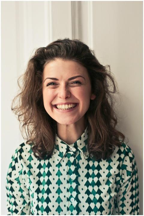 Portrait of a joyful brunette woman with a vibrant