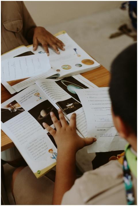 Two students engaging with planetary science mater