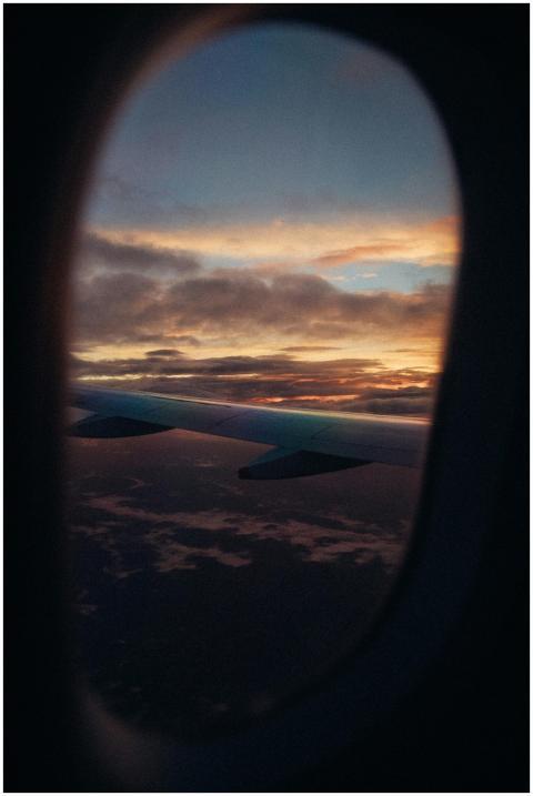 A scenic view of an airplane wing against a vibran