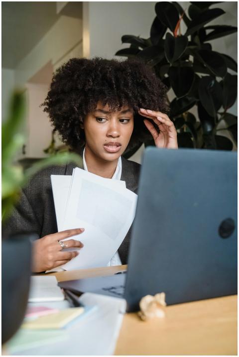 Focused woman feeling stressed while working with