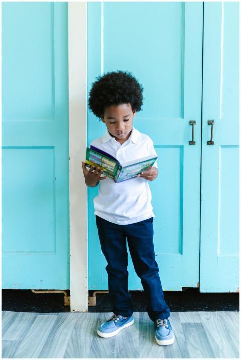 Charming scene of a young boy immersed in reading