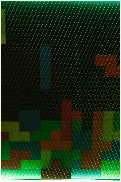 Vibrant geometric shapes on wire mesh create a Tet