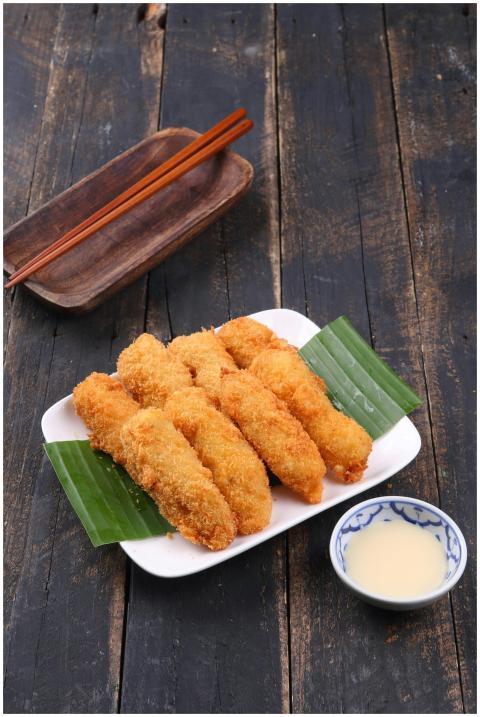 Delicious fried bananas served on a white plate wi