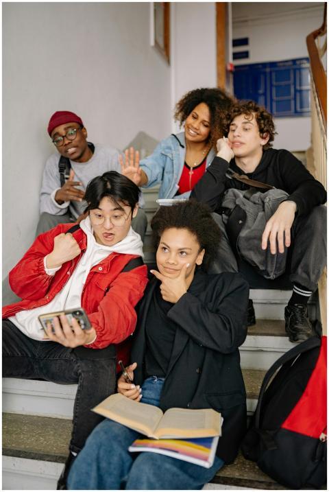 A diverse group of students posing together on sta