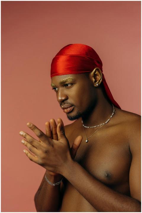 Portrait of a young man with a red headscarf, show