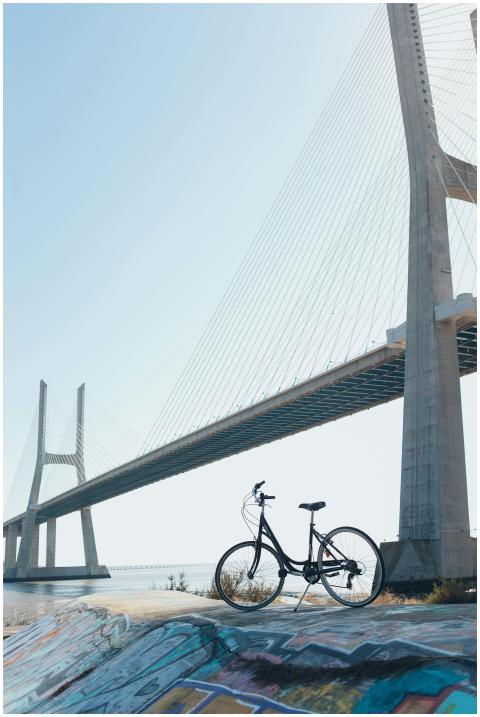 A bicycle with vibrant graffiti beneath a striking