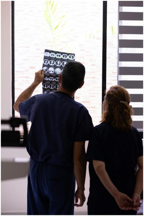 Medical professionals examining an X-ray for diagn