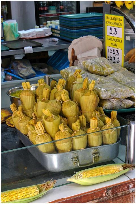 Delicious hallaquitas and fresh corn displayed at