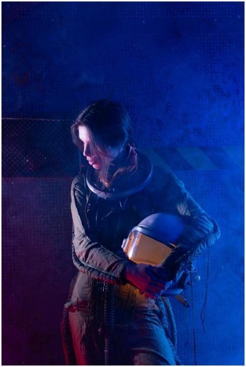 A futuristic portrait of a woman in a spacesuit am