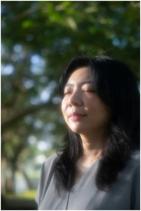 Portrait of a serene Asian woman with closed eyes