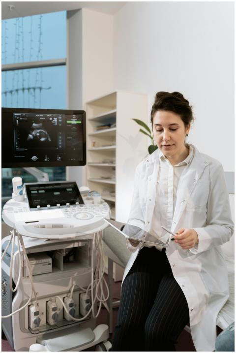 A female doctor in a clinic reviewing ultrasound i