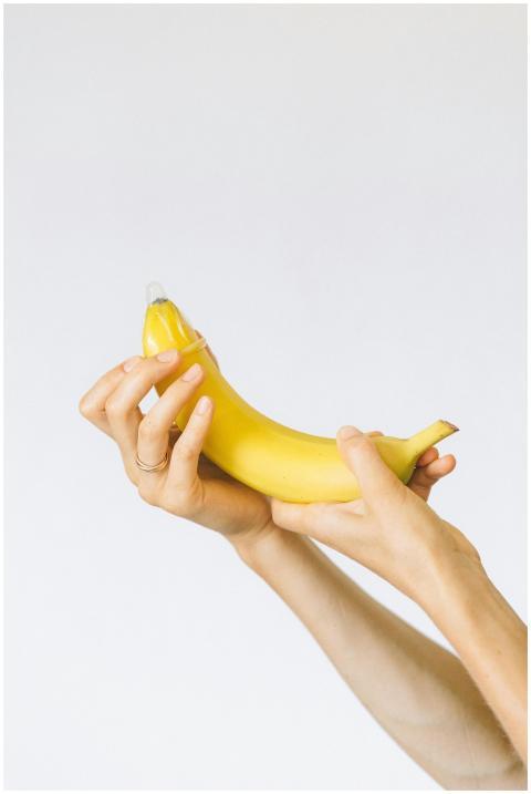 A banana with a condom, symbolizing safe sex educa