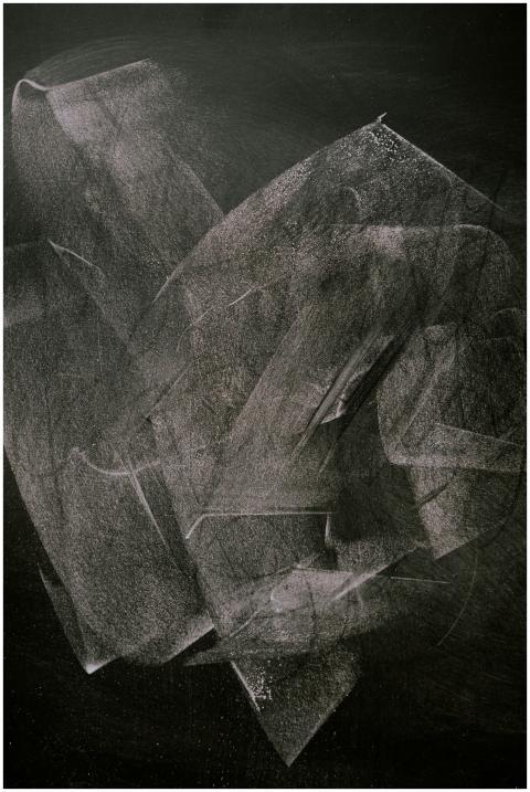 Abstract art showcasing smudged white chalk patter