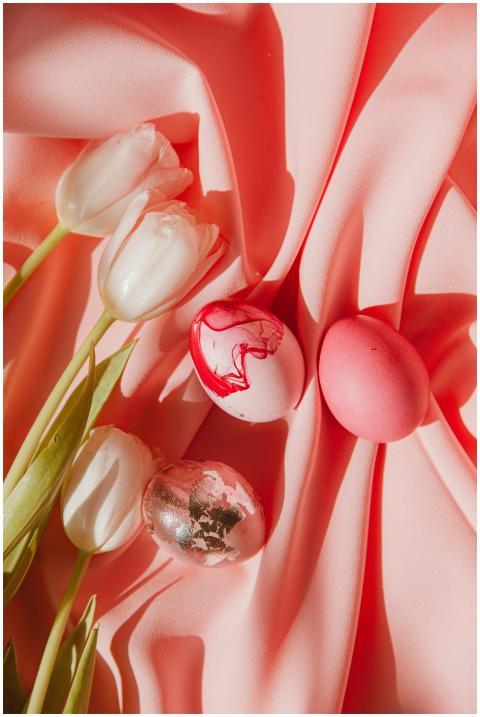Artistic arrangement of tulips and Easter eggs on