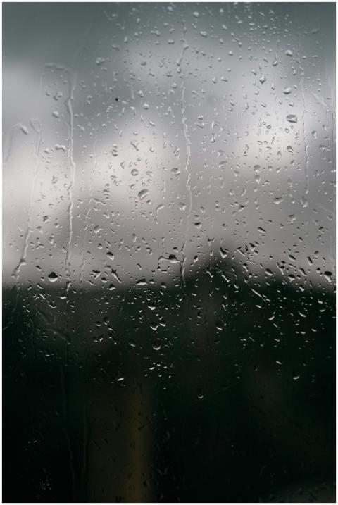 Captivating view of raindrops on glass with a blur