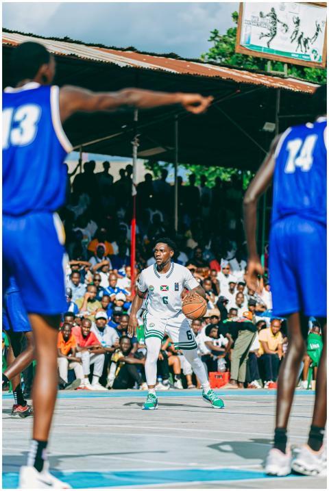 Intense outdoor basketball game with passionate cr