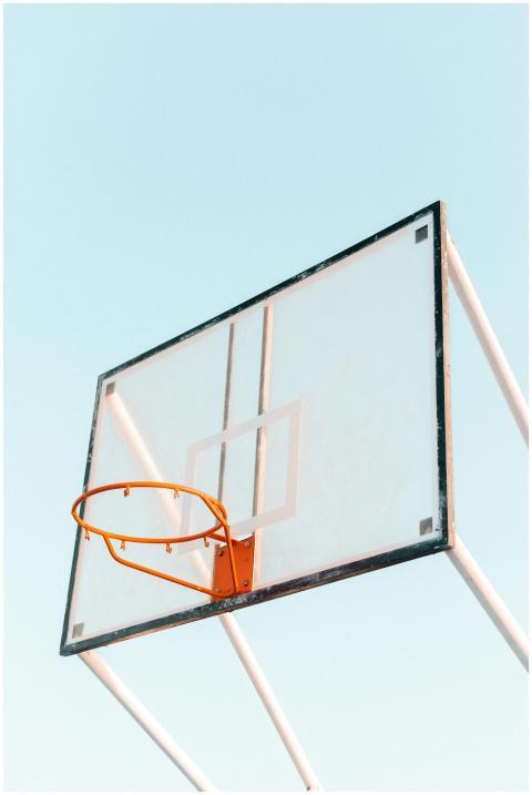 Minimalist photo of a basketball hoop and backboar