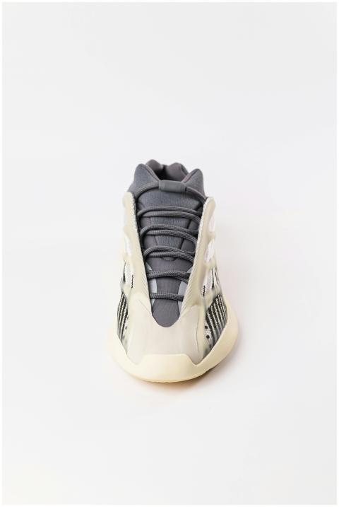 Front view of a stylish modern sneaker on a minima