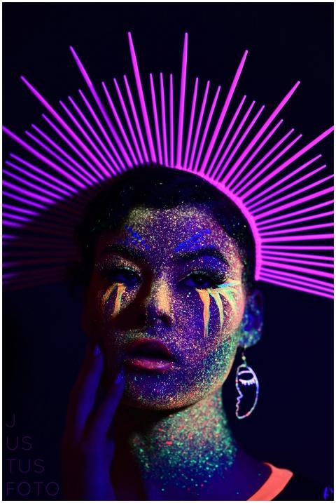 Striking portrait of a woman with neon makeup and