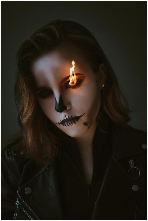 Spooky portrait of a woman with flaming eye makeup