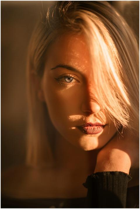 Captivating portrait of a blonde woman bathed in w