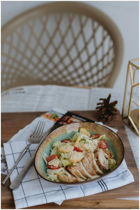 Appetizing Caesar salad with grilled chicken serve