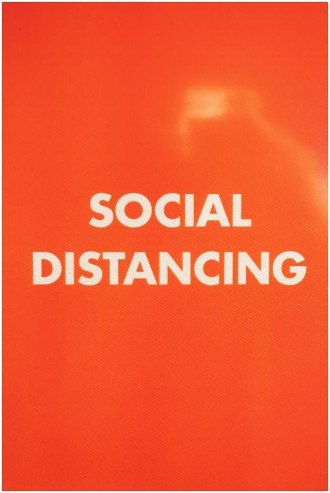 Bright orange sign with 'Social Distancing' text s