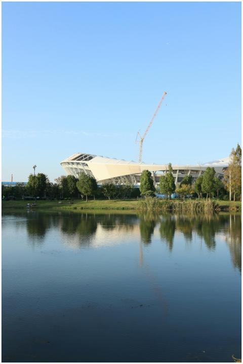 A contemporary architectural structure stands besi