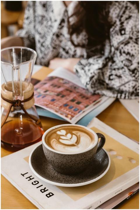 Close-up of a cappuccino with latte art next to a
