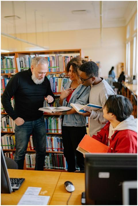 Four diverse students engaged in a collaborative s