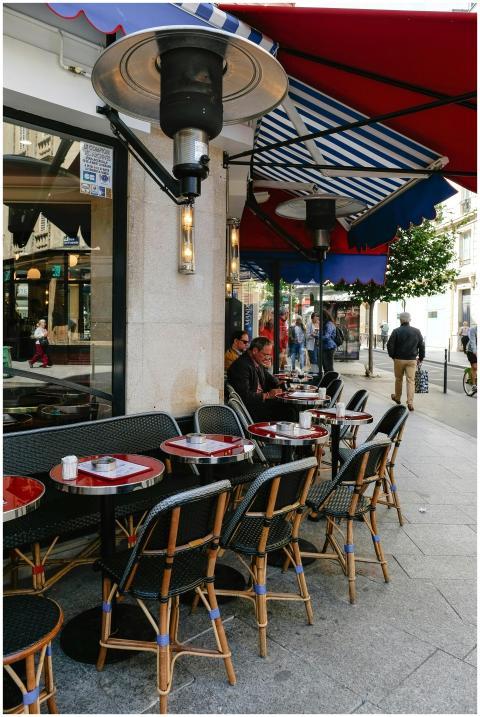 Charming Parisian café setting with outdoor seatin