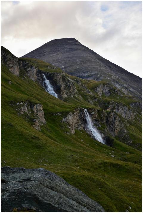 Stunning waterfalls cascading down a green mountai